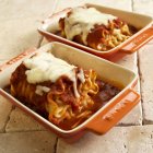 Rolled cheese lasagna with marinara sauce — Stock Photo