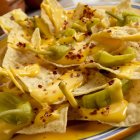 Nachos with Pepperoncinis on platter — Stock Photo