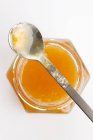 Apricot jam in jar with spoon — Stock Photo