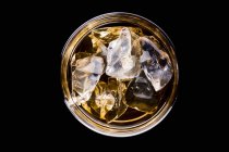 Whiskey with ice cubes — Stock Photo