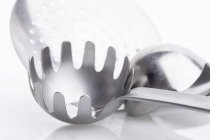 Closeup view of a spaghetti server, a draining spoon and a ladle — Stock Photo