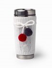 Closeup view of thermal stainless steel mug with white knitted cover — Stock Photo