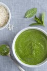 Freshly Made Spinach and Mint Pesto in a Bowl over textile surface — Stock Photo