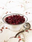 Closeup view of cranberry sauce with ladle — Stock Photo