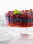 Closeup view of salad with cream and berries — Stock Photo