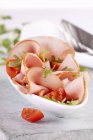 Ham slices with rocket and tomatoes — Stock Photo