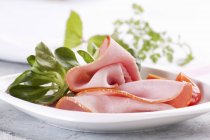 Ham slices with watercress — Stock Photo