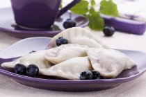 Sweet ravioli pasta with blueberries — Stock Photo