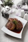 Duck pieces in red wine sauce — Stock Photo
