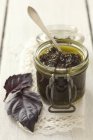 Jar of purple basil pesto — Stock Photo