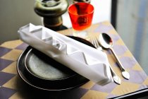 Elevated view of a place setting with an artistically folded napkin — Stock Photo