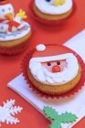 Cupcake with Father Christmas decoration — Stock Photo