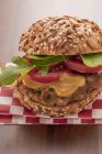 Burger with mustard and arugula — Stock Photo