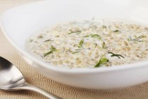 Creamy Barley Soup in white bowl — Stock Photo