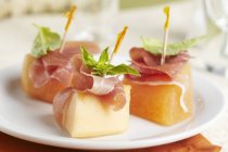 Melon with Prosciutto and Basil Appetizers — Stock Photo