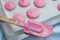 Piles of pink macaroon dough — Stock Photo