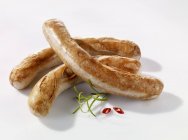 Fried white sausages — Stock Photo