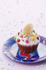 Cupcake decorated with colourful sugar — Stock Photo