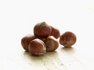 Heap of Hazelnuts on wooden — Stock Photo