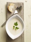 Cream of kohlrabi soup in white bowl — Stock Photo