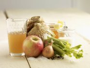 Ingredients for celery and apple soup on wooden surface — Stock Photo