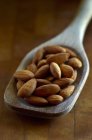 Almonds in Wooden Spoon — Stock Photo