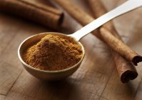 Ground Cinnamon in a Measuring Spoon — Stock Photo