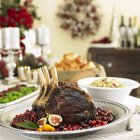 Close up of  Crown Roast Pork on a Platter of Cranberries — Stock Photo