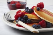 Pancakes Topped with Berry Syrup — Stock Photo