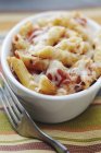 Baked penne pasta with tomatoes — Stock Photo