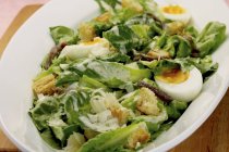 Caesar salad with egg — Stock Photo