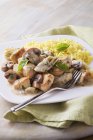 Basil chicken in creamy sauce with rice — Stock Photo