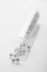 Closeup view of a tube of white globules — Stock Photo