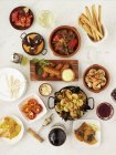 Top view of assorted tapas on white surface — Stock Photo
