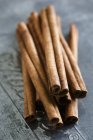 Cinnamon sticks on blue background — Stock Photo