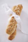 Plaited bread with textile — Stock Photo