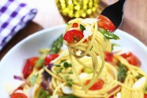 Spaghetti with vegetables and cheese — Stock Photo