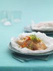 Salmon fillet in parchment paper — Stock Photo