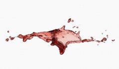 Splash de suco vermelho — Fotografia de Stock