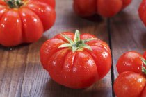 Tomatoes with drops of water — Stock Photo