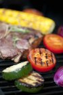 Steak and vegetables on grill — Stock Photo