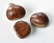 Whole edible chestnuts — Stock Photo