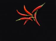 Chillies on a black background — Stock Photo