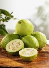 Fresh guavas with halves — Stock Photo