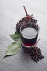 Glass of elderberry juice — Stock Photo