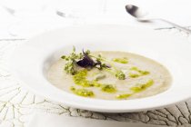 Bowl of Creamy Artichoke Soup with Pesto — Stock Photo