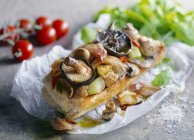 Baguette with mushrooms and onions — Stock Photo