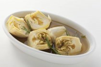 Pickled artichokes in plate — Stock Photo