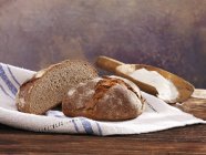 Halved sourdough loaf with rye — Stock Photo