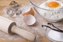 Closeup view of baking ingredients, cookie cutters and rolling pin — Stock Photo